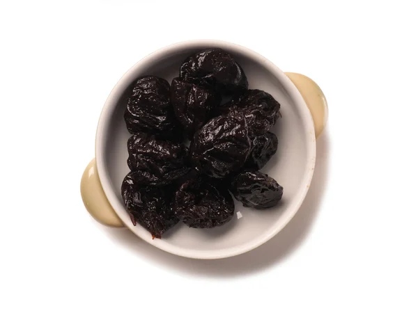 Dried plums in a bowl — Stock Photo, Image