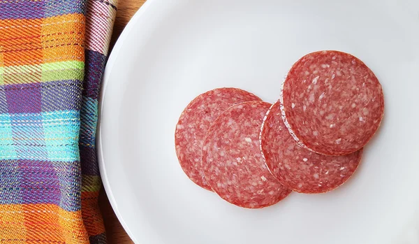 Slices of pork fatty salami