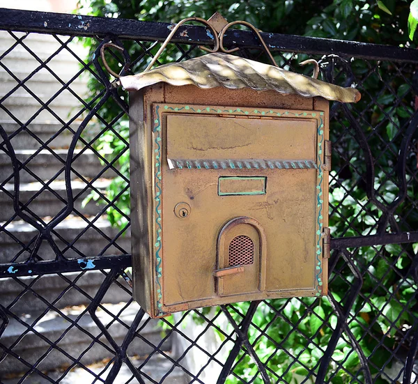 Old mailbox on fence background — Stock Photo, Image