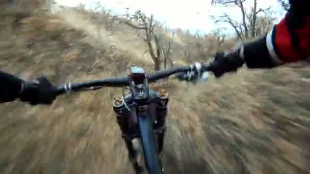 Fast Bikers Move in Pursuit Down the Hill — Stock Video