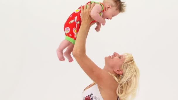 Young Mother Holding Her Son Aloft — Stock Video