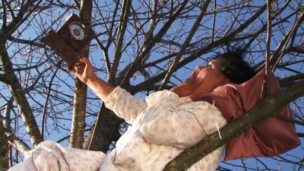 Crazy Dark-Haired Woman In Long White Nightie Laughing Lying On Tree — Stock Video