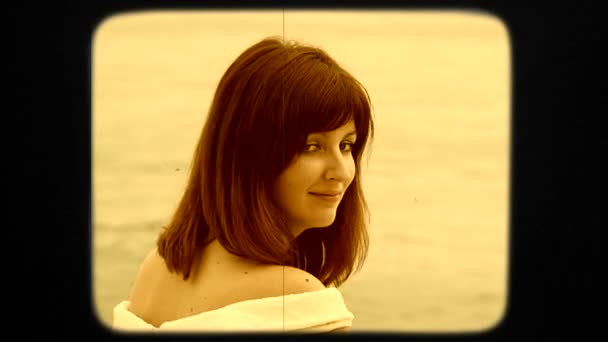 Young Pretty Dark-Haired Woman In White Dress Posing By Sea — Wideo stockowe