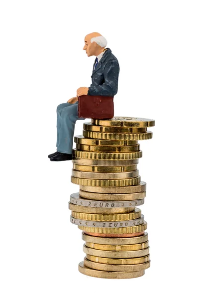 Pensioners sitting on a pile of money — Stock Photo, Image