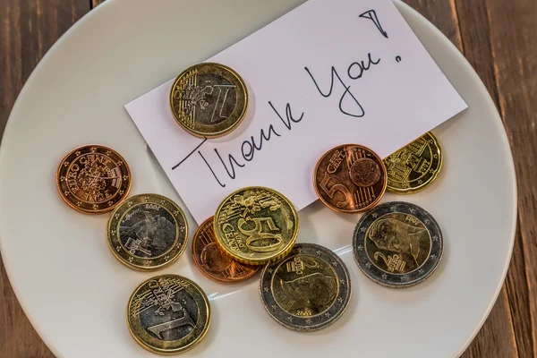 Plate with coins — Stock Photo, Image