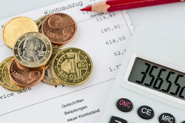 Account statement and coins — Stock Photo, Image