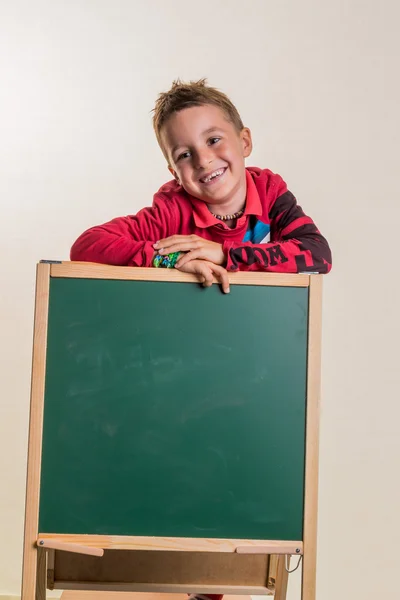 Schoolboy with school board — Stock Photo, Image