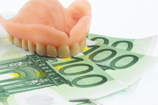 Dentición y billetes en euros — Foto de Stock