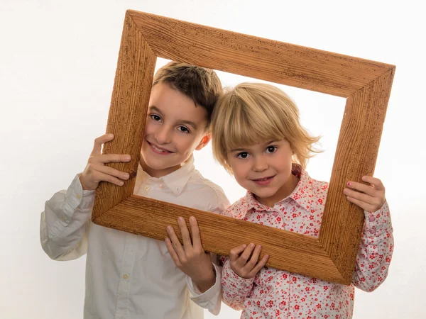 Child looking through a frame — Stock Photo, Image