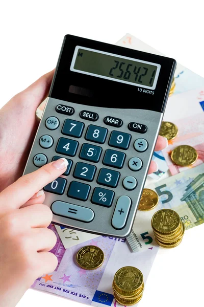 Mão com calculadora e dinheiro — Fotografia de Stock