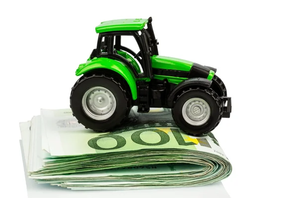 Tractor on euro banknotes — Stock Photo, Image