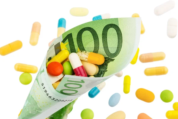 Tabletter och hundra eurosedel — Stockfoto