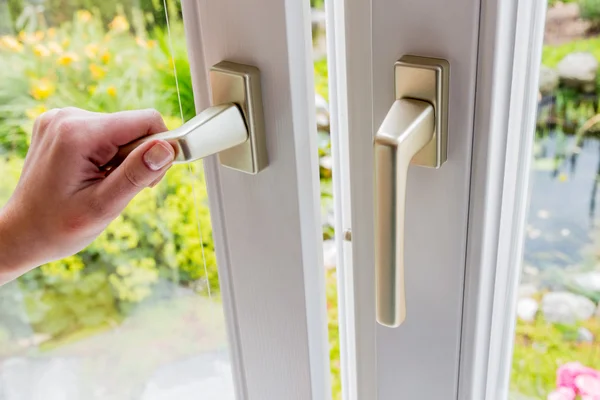 Woman opens window for ventilation — Stock Photo, Image