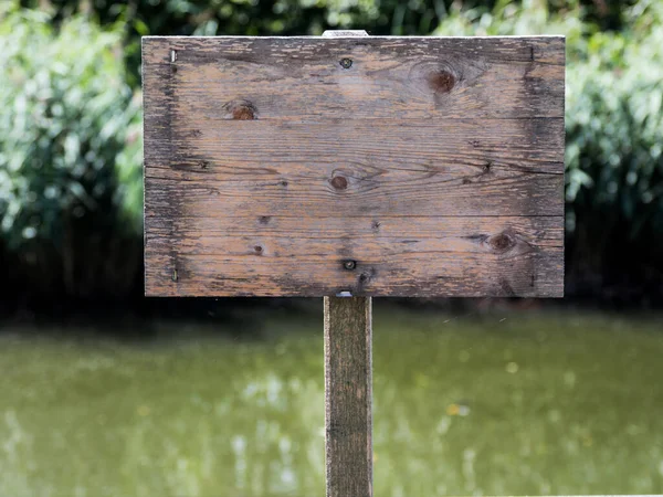 Empty wooden sign without inscription. Royalty Free Stock Photos