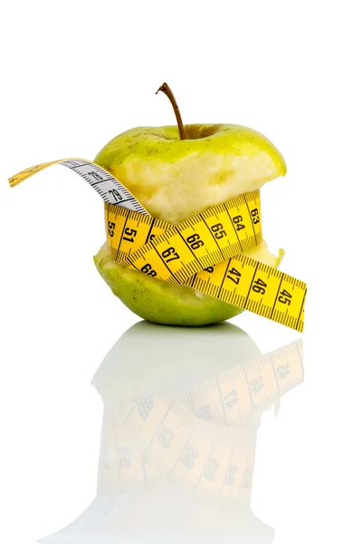 Apple with measuring tape on — Stock Photo, Image