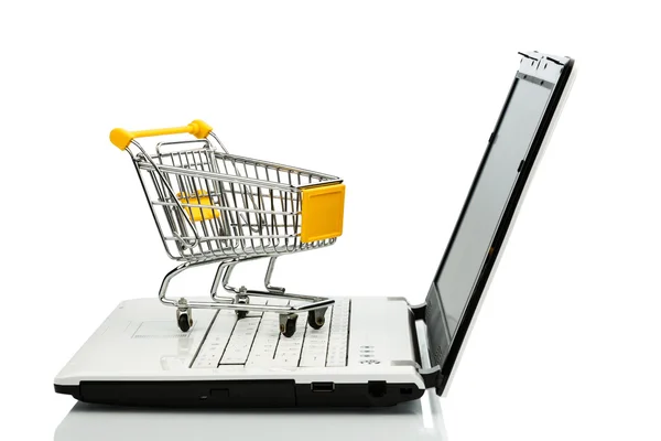 Shopping cart and laptop — Stock Photo, Image