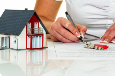 woman signs purchase agreement for house clipart