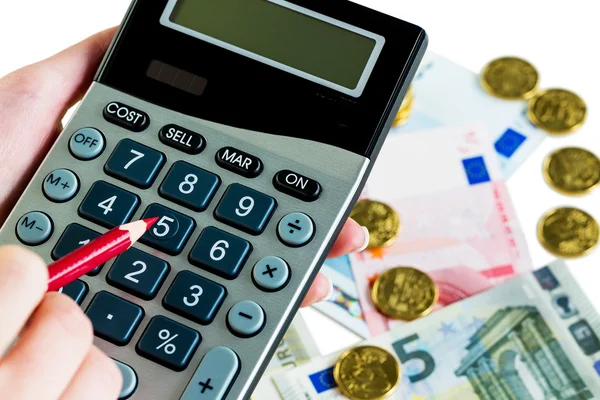 Ręka z kalkulatora i pieniądze — Zdjęcie stockowe