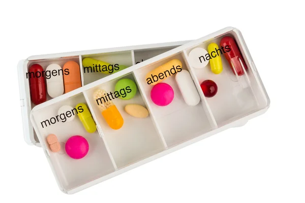 The pill dispenser and tablets — Stock Photo, Image