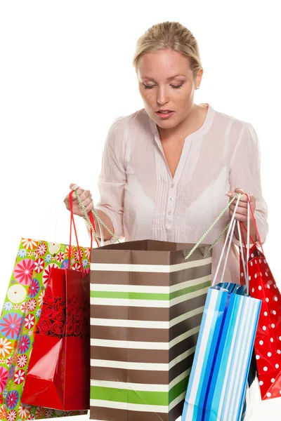 Mujer con bolsas de compras coloridas Imagen de archivo