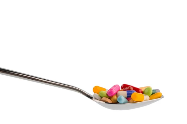 Veel tabletten op lepel — Stockfoto