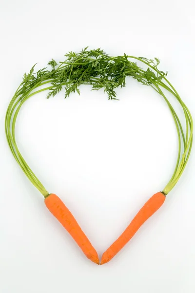 Świeże marchewki w kształcie serca — Zdjęcie stockowe