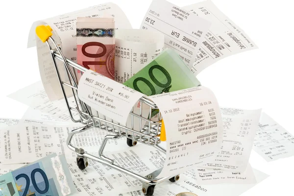 Shopping cart, receipts and money — Stock Photo, Image