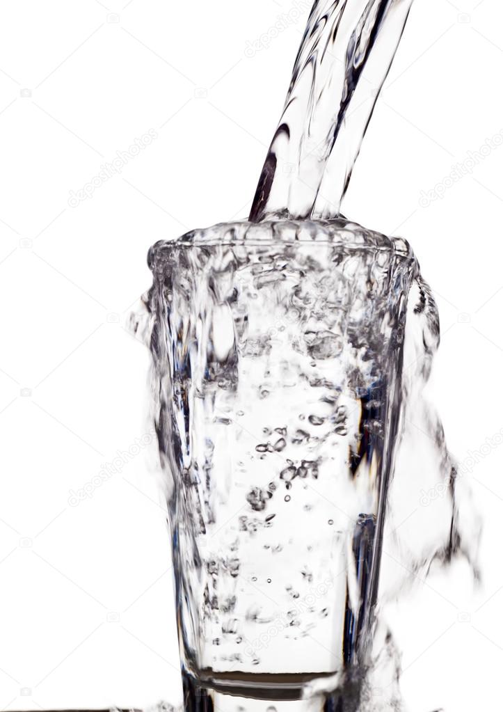 Water is poured into a water glass — Stock Photo © ginasanders 59184017