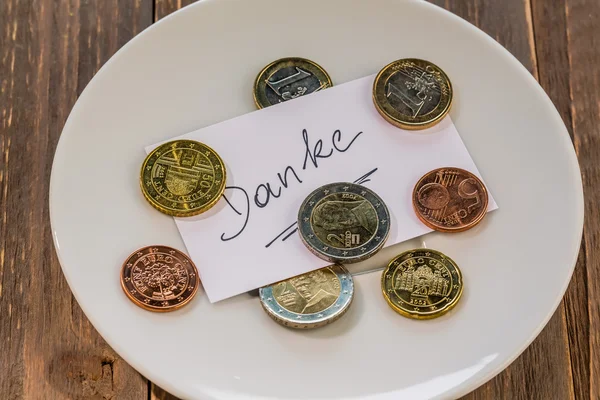 Plate with coins — Stock Photo, Image