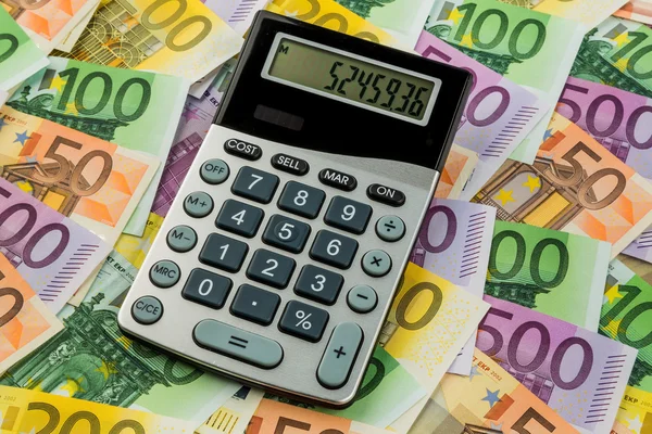 Calculator and euro banknotes — Stock Photo, Image