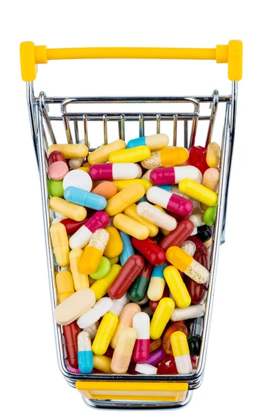 Kleurrijke tabletten in winkelwagen — Stockfoto