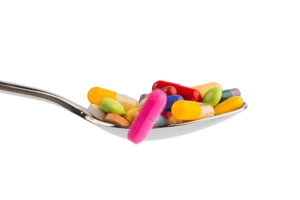 Veel tabletten op lepel — Stockfoto