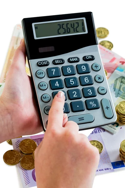 Hand with calculator and money — Stock Photo, Image