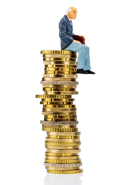 Pensioners sitting on cash pile — Stock Photo, Image