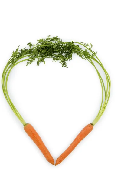 Fresh carrots in heart shape — Stock Photo, Image