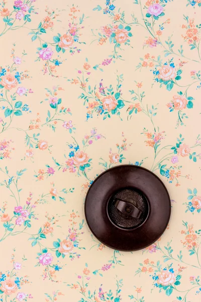 Old wallpaper with light switch — Stock Photo, Image