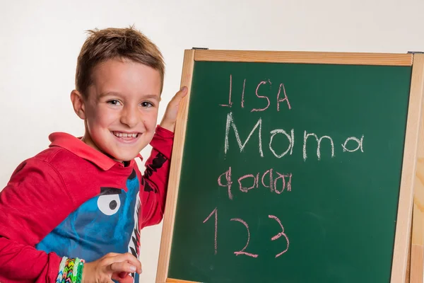 Écolier avec conseil scolaire — Photo