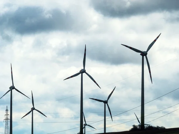 Wind turbine and power poles — Stock Photo, Image