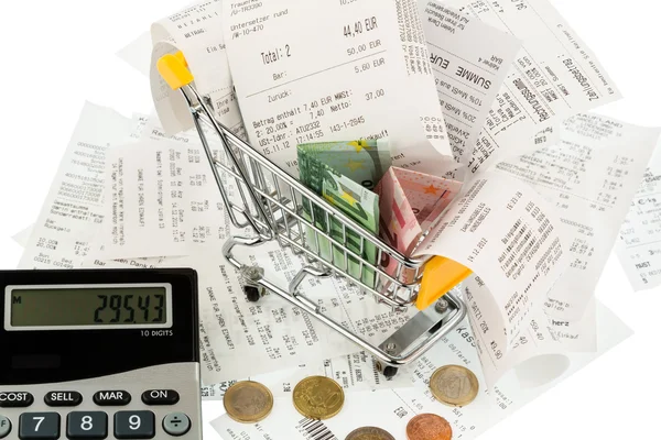 Shopping cart, receipts and money — Stock Photo, Image