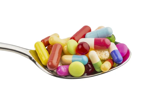 Många tabletter på sked — Stockfoto