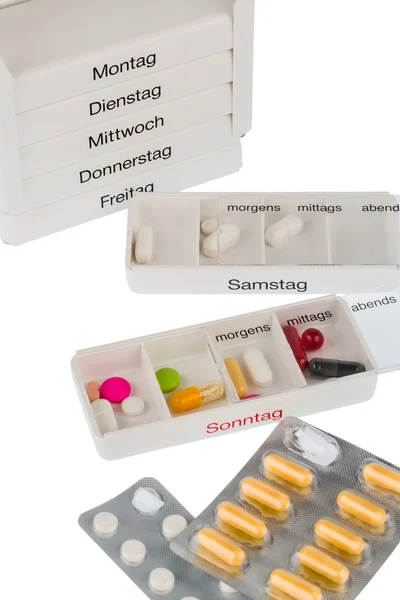 Tablettenspender und Tabletten — Stockfoto