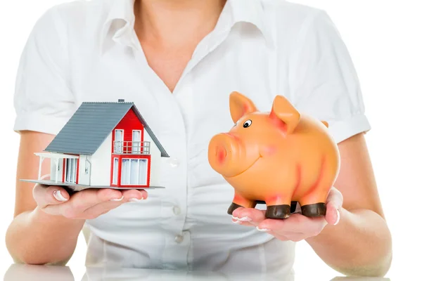 Woman with house and piggy bank — Stock Photo, Image