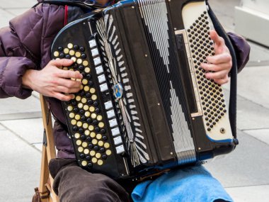 musician playing on accordion clipart