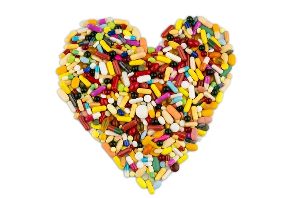 Barevné tablety ve tvaru srdce — Stock fotografie