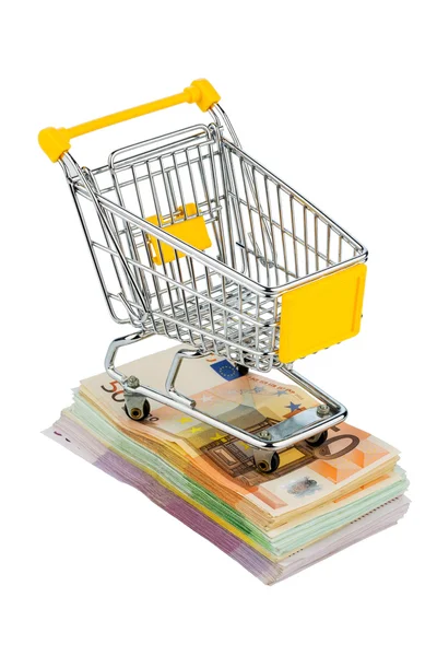 Shopping cart on bills — Stock Photo, Image