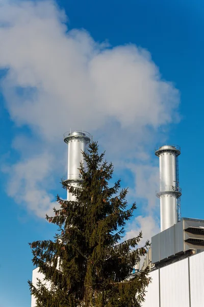 Industrial chimney with tree — Stock Photo, Image