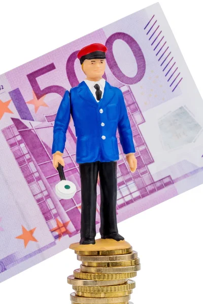Railway worker stands on money stack — Stock Photo, Image