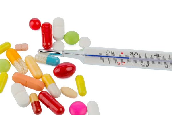 Thermometer en tabletten — Stockfoto