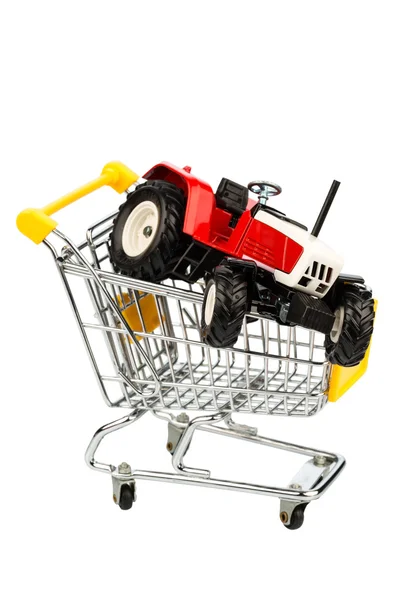 Tractor in shopping cart — Stock Photo, Image