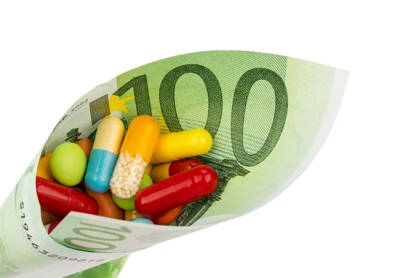 Tablets and hundred euro bill — Stock Photo, Image